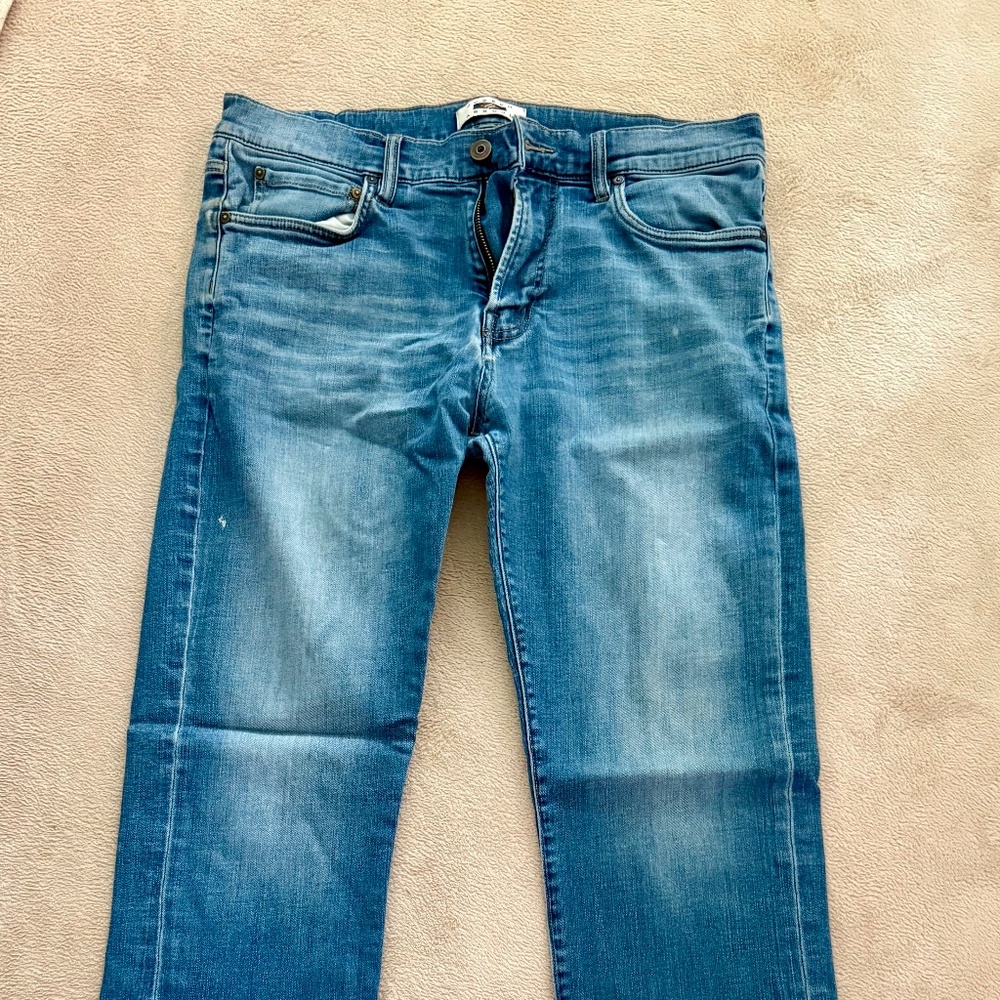 Classic Fit intentionally distressed blue jeans
